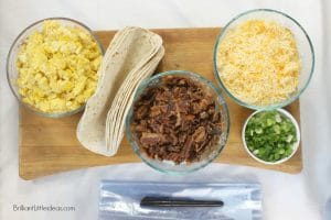 Easy Freezer Breakfast Burritos are a staple at my house. Its a make ahead alternative to cereal for kids. #breakfastburritos #freezer food