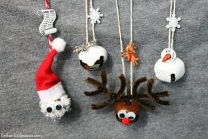 Create all 4 fun & Festive Christmas Bell Necklaces for you kids. They also make great gifts. Choose from a snowman necklace, Santa necklace, reindeer necklace, or a snowflake necklace. Great kid crafts to keep them busy while you wrap presents. make your diy necklace with a how to video #christmascraft #christmasgifts
