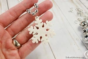 Let your kids create a fun winter craft, or give them as party favors. Snowflake Necklaces are my go to k way to keep kids busy on those snow days, or rainy days. This DIY kid necklace craft is easy for older kids to make by themselves. Kids will love to give these to their friends.