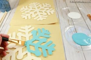 Your kids are going to love this DIY Snowflake Wand party favor. It goes great with a Frozen Elsa Costume. We used ours for pretend play being Snow Queens in a winter wonderland. Beautiful Birthday party favors or centerpieces. Watch the video on how to make your own snowflake wand